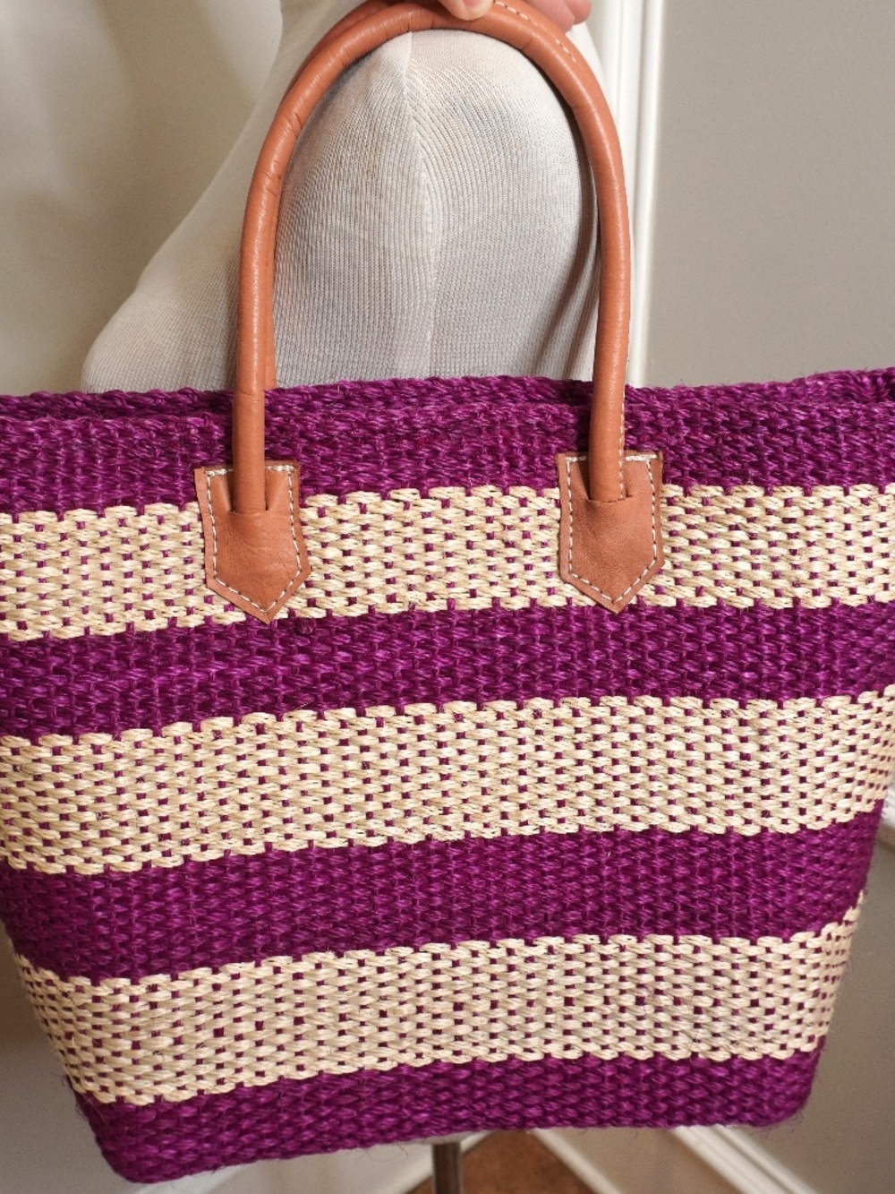 Crown & Ivy striped straw tote featuring pink and beige woven material with brow
